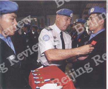 FOR WORLD PEACE: Chinese peacekeepers in Haiti are awarded medals for their dedication to world peace. As China grows stronger, it plays a more active role in world affairs to fulfill its own obligations as a world stakeholder